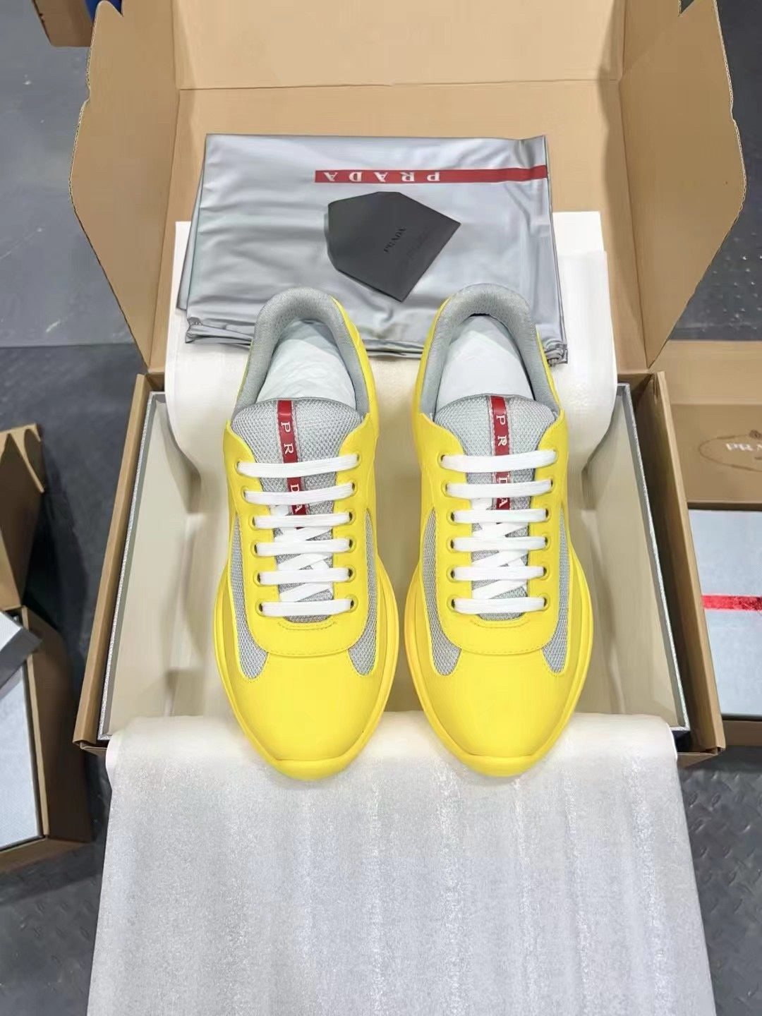 PRADA America's Cup yellow