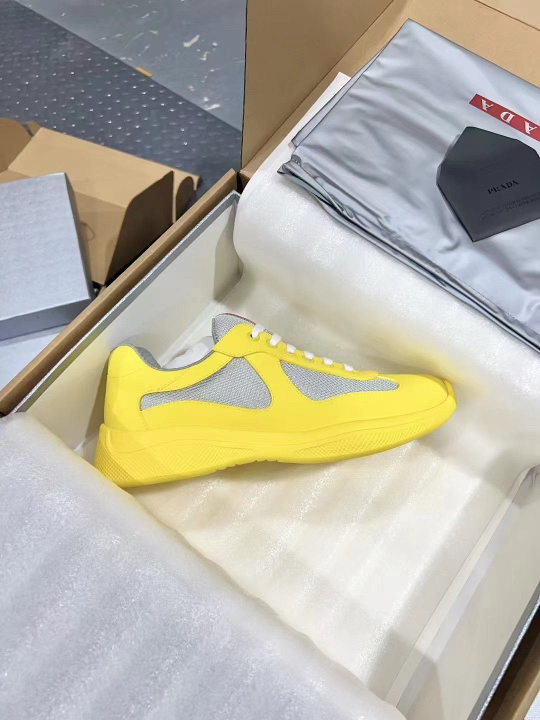 PRADA America's Cup yellow