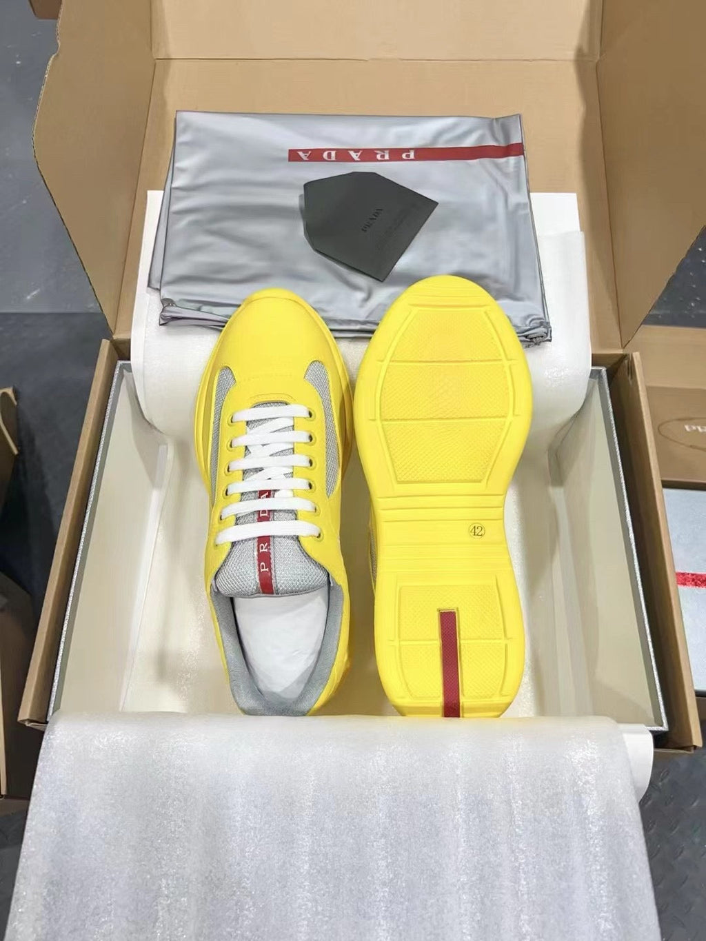 PRADA America's Cup yellow