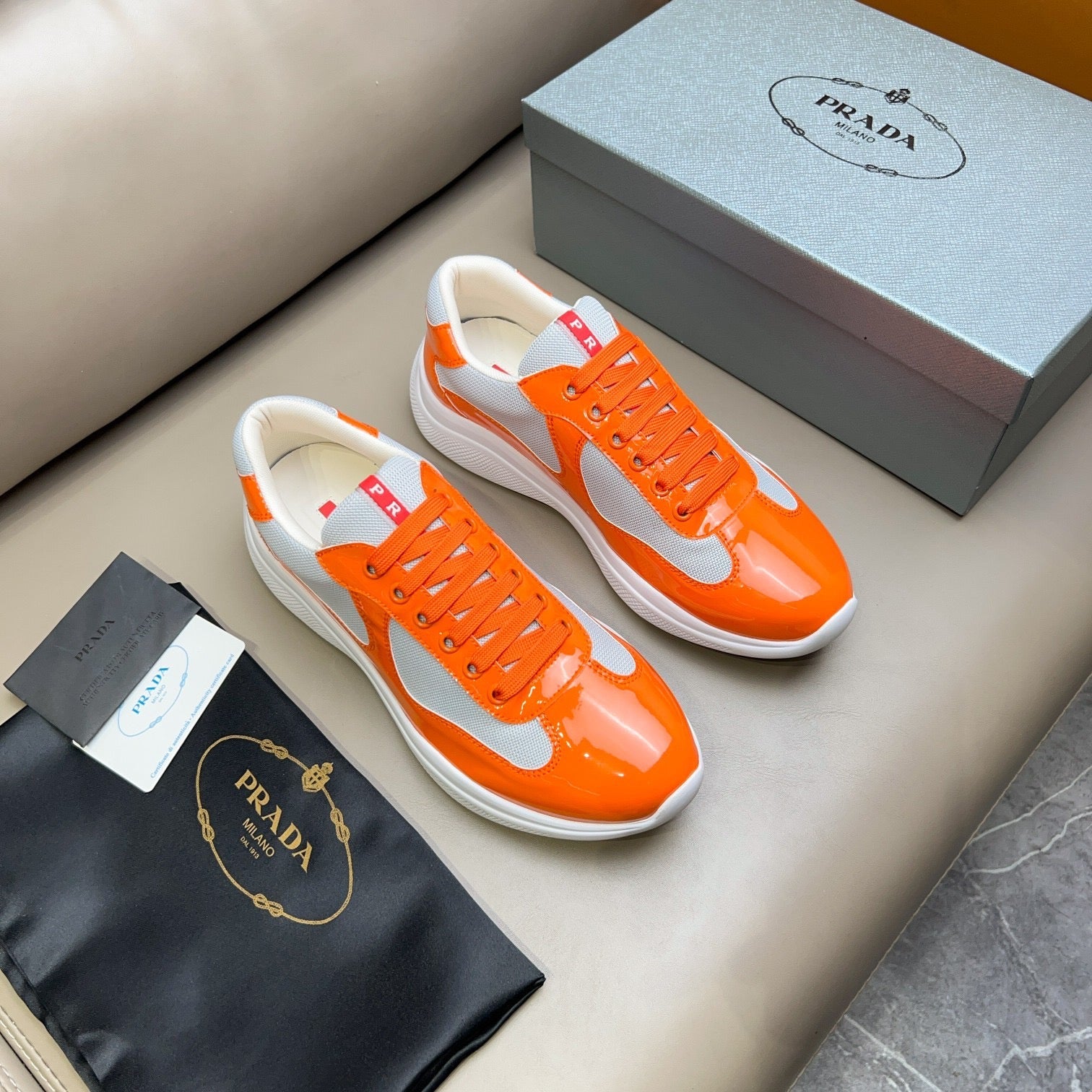 PRADA America's Cup orange