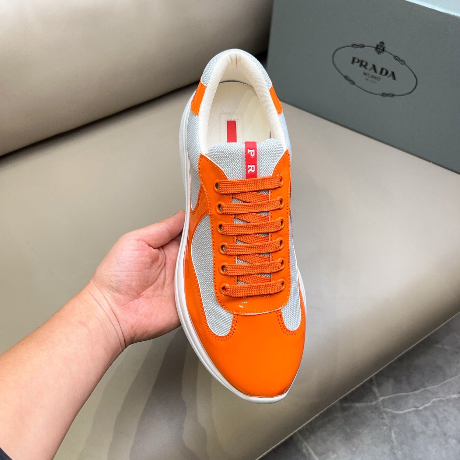 PRADA America's Cup orange