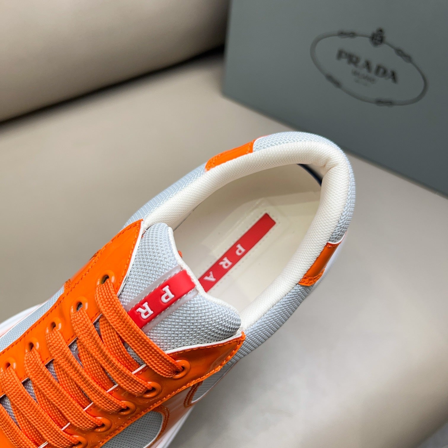 PRADA America's Cup orange