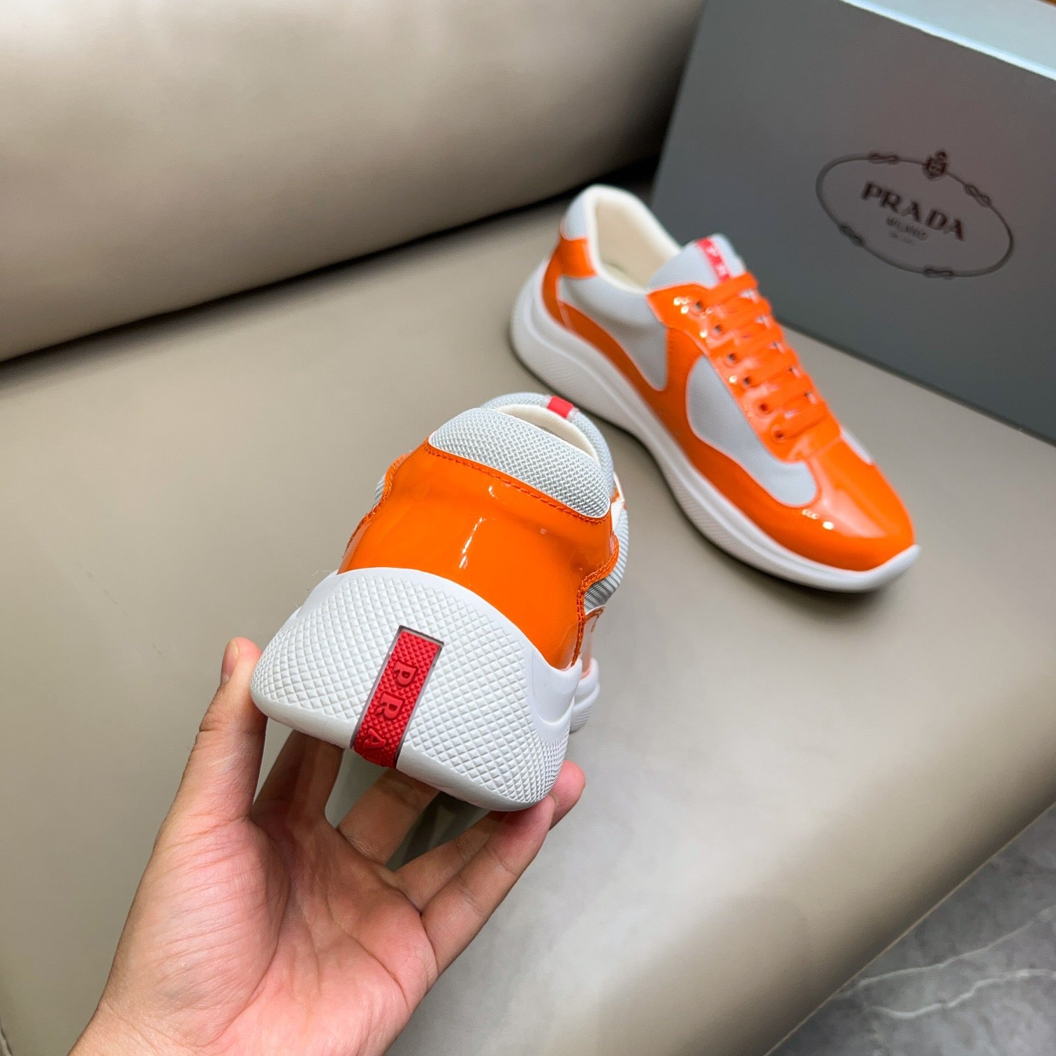 PRADA America's Cup orange