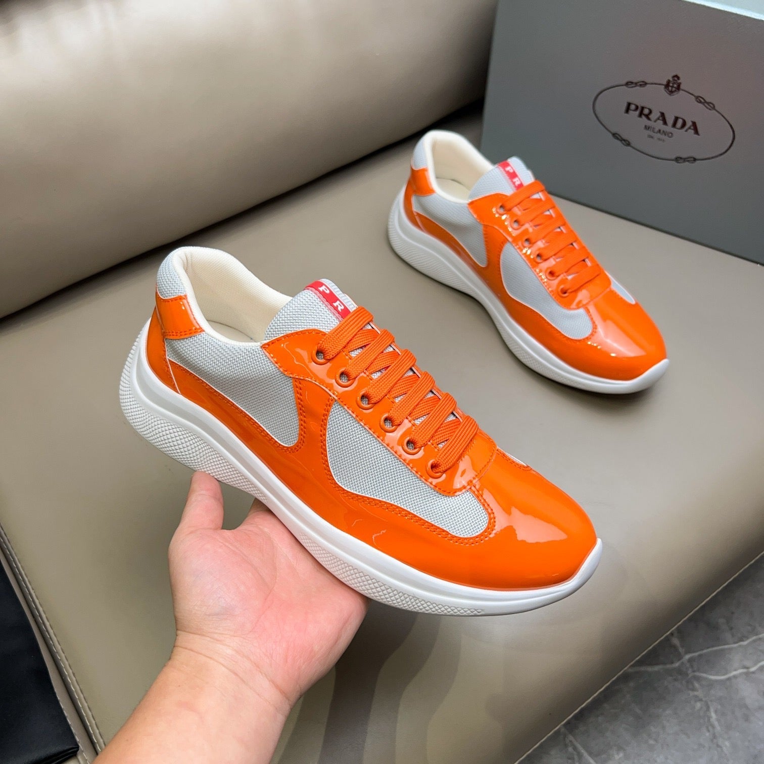 PRADA America's Cup orange