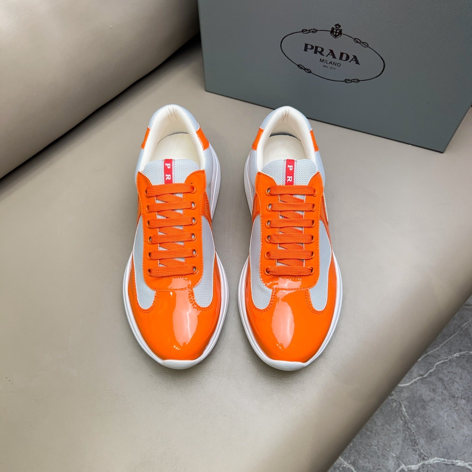 PRADA America's Cup orange