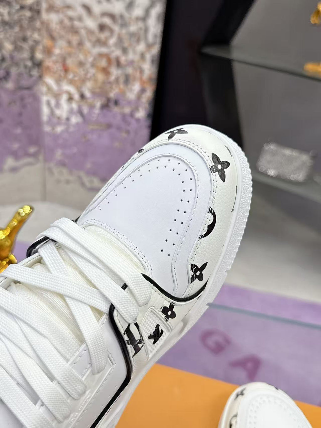 LV trainer white and black print