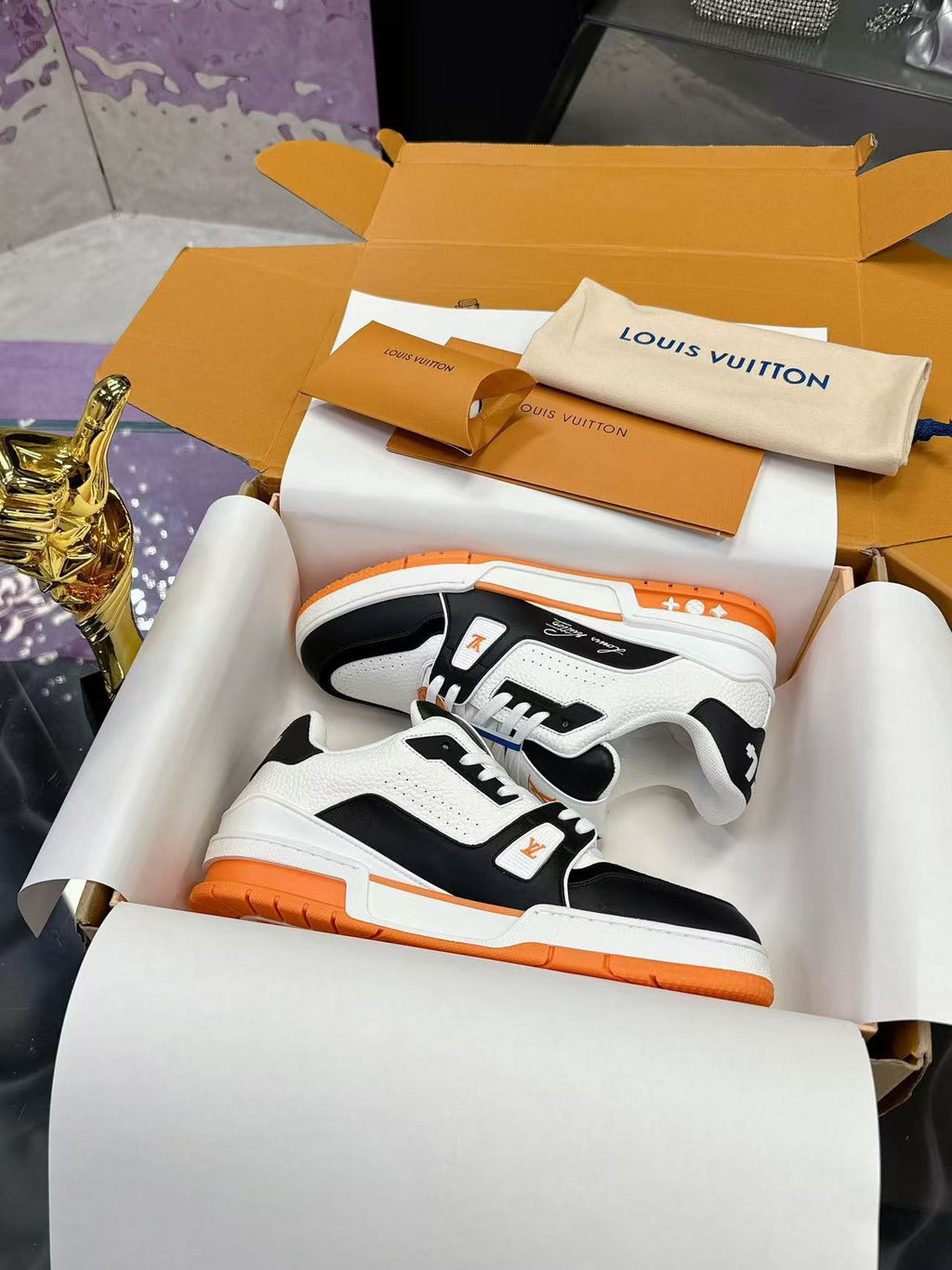 LV trainer orange, white and black