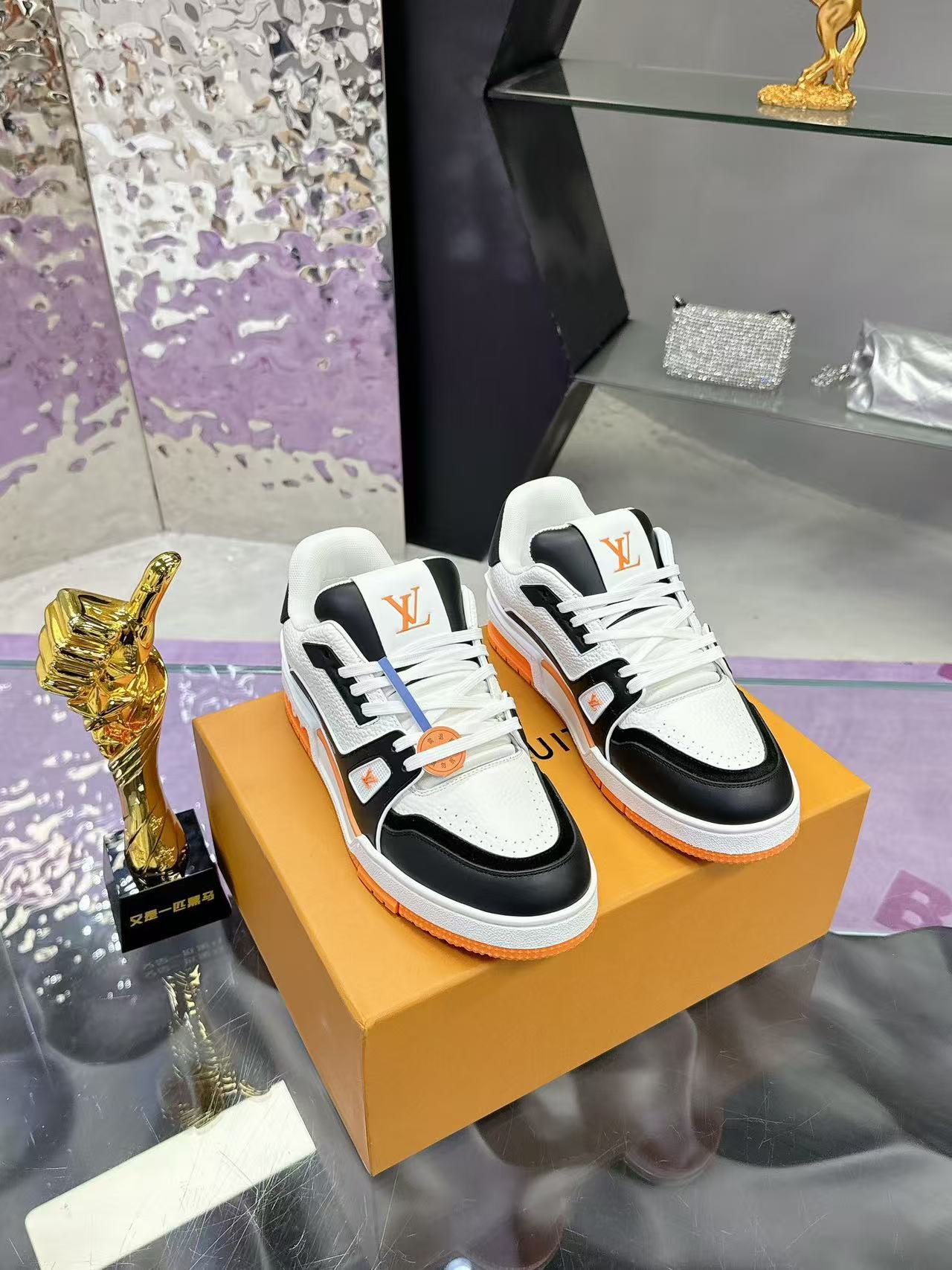 LV trainer orange, white and black