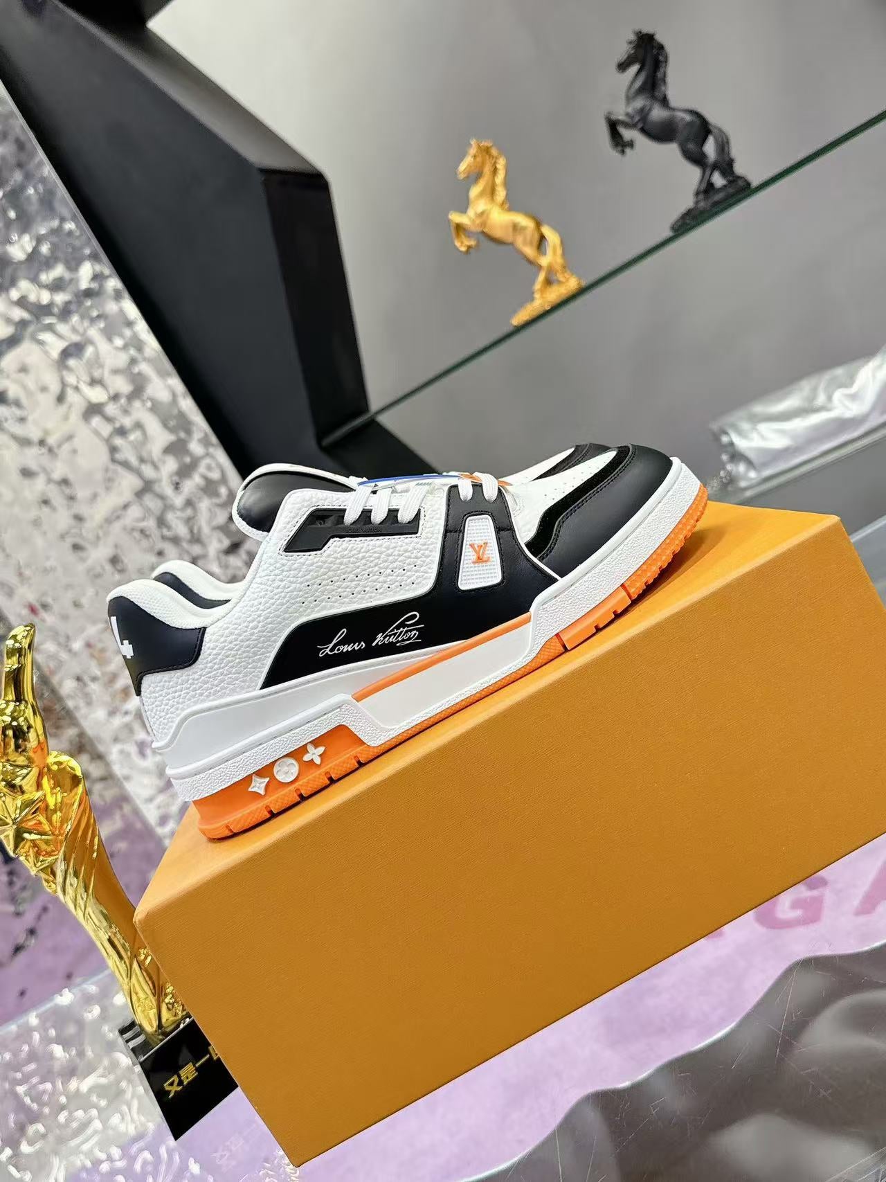 LV trainer orange, white and black