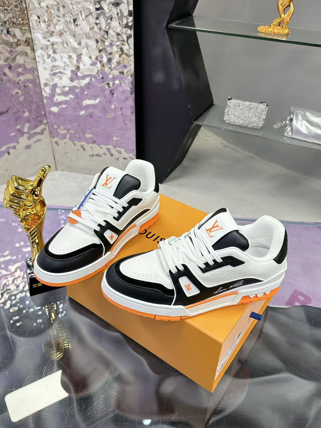 LV trainer orange, white and black