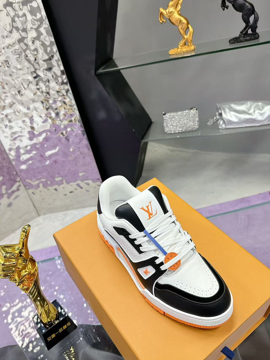 LV trainer orange, white and black