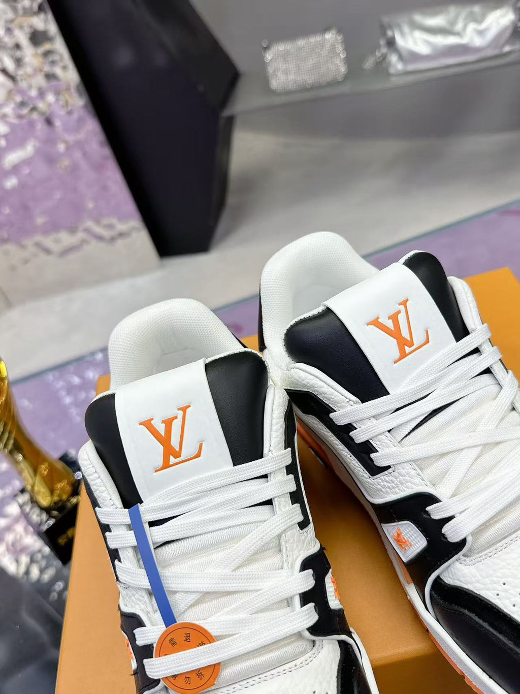 LV trainer orange, white and black