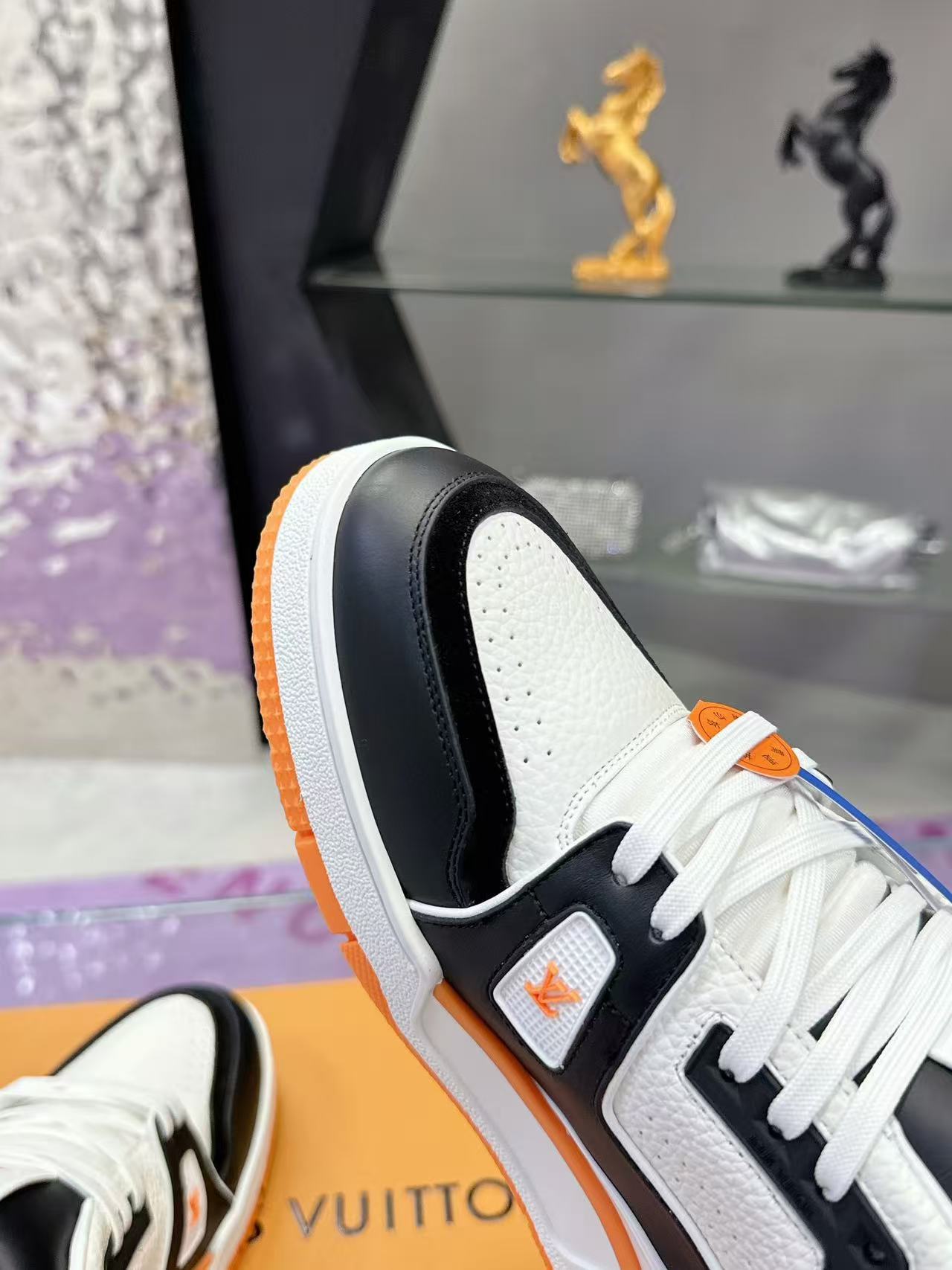 LV trainer orange, white and black