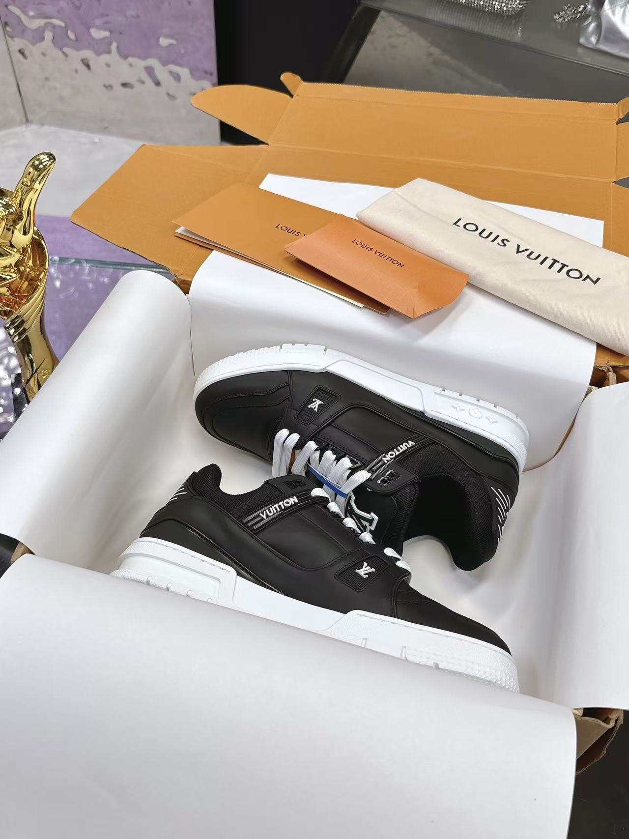 LV trainer black with white background