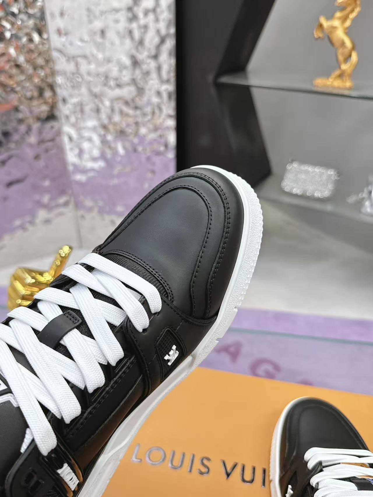 LV trainer black with white background