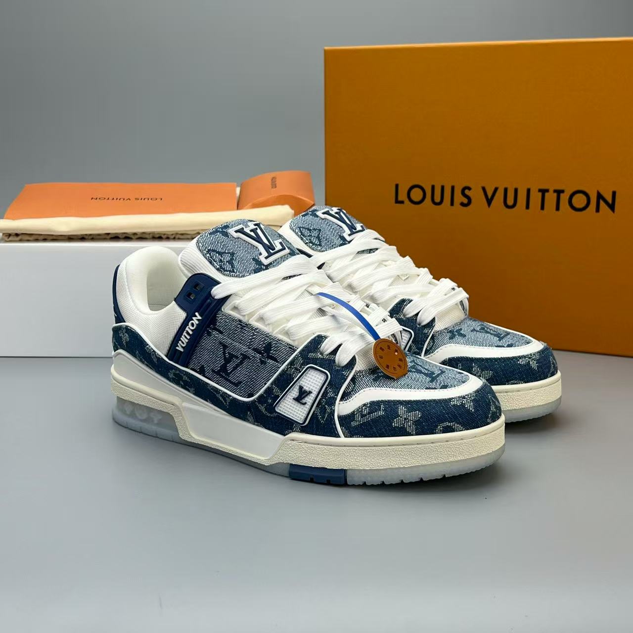 LV trainer blue denim crystal bottom