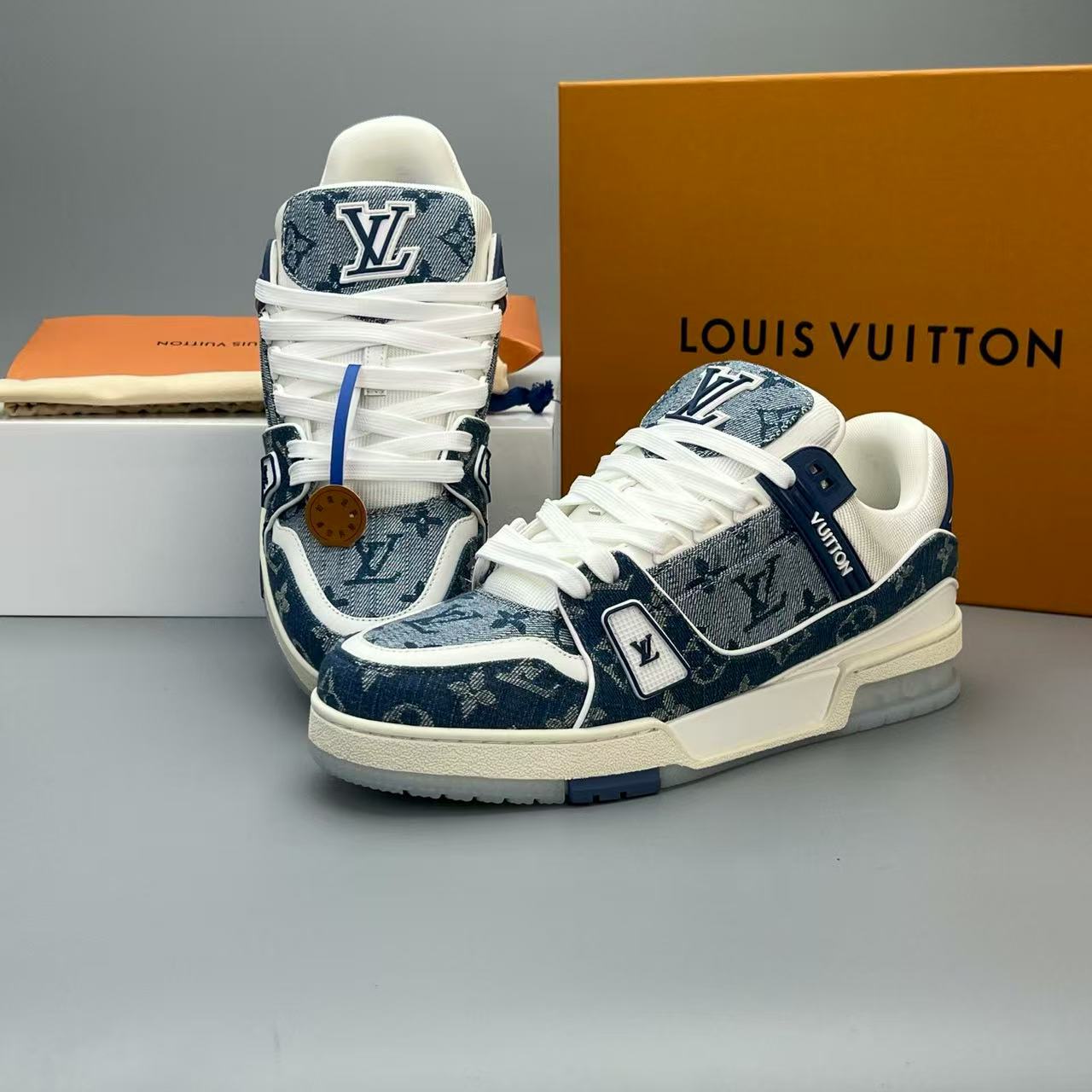 LV trainer blue denim crystal bottom