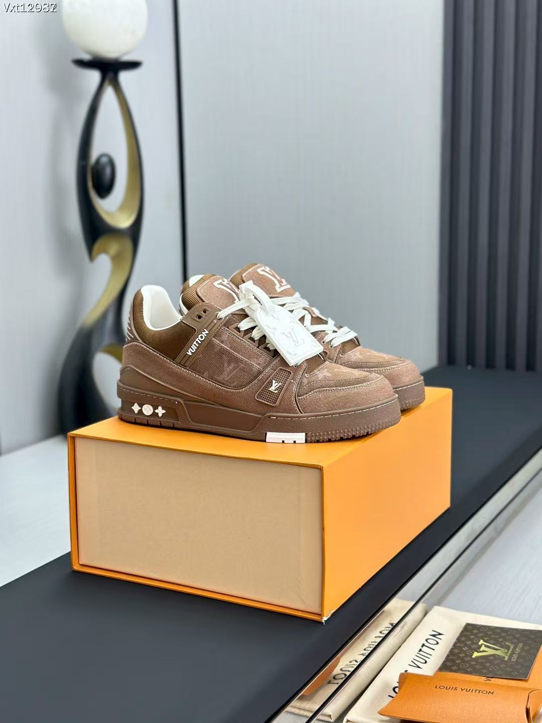 LV trainer brown denim