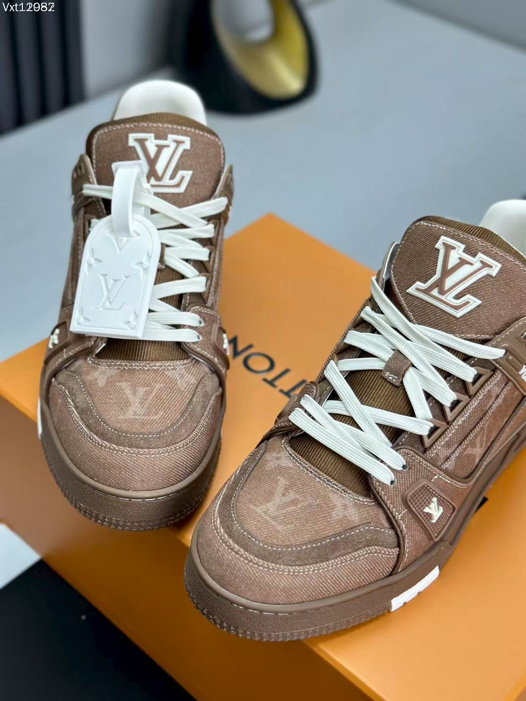 LV trainer brown denim
